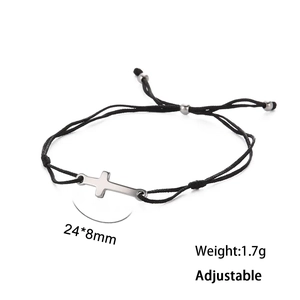 Close-up of adjustable black woven cross bracelet with silver metal charm and 24*8mm size tag
