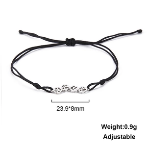 Adjustable black cord bracelet with silver cat paw print pendant and size details