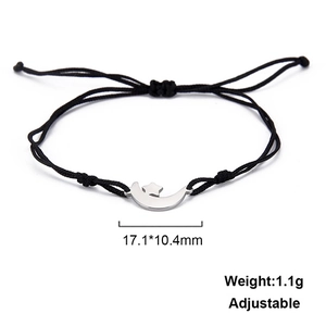 Detail of adjustable black cord bracelet featuring moon and star charms with dimensions