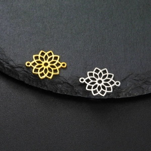 Golden and silver mandala lotus connector charms for DIY necklaces on a dark stone background