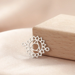 Macro view of silver stainless steel yoga chakra lotus charm connector for DIY jewelry