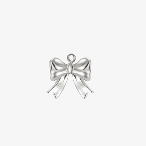 Macro view of a polished stainless steel bow charm with mirror finish for DIY jewelry