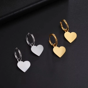 Polished stainless steel heart dangle hoop earrings in gold and silver finishes