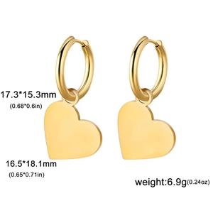 Macro shot showing dimensions of gold stainless steel heart hoop earrings on white background