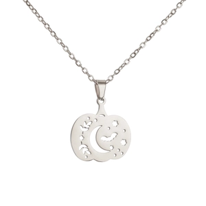 Detail view of silver stainless steel pumpkin pendant necklace with hollow Halloween motifs