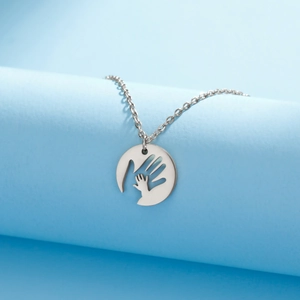 Hollow round pendant necklace with big and small hands design in stainless steel