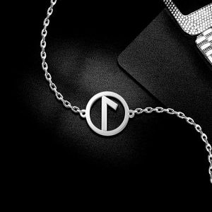 Macro detail of silver Nordic Rune pendant with minimalist Laguz symbol on link chain