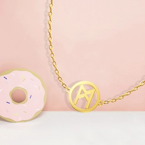 Detail of 18K gold-plated Viking rune pendant necklace with close-up of geometric镂空 pattern