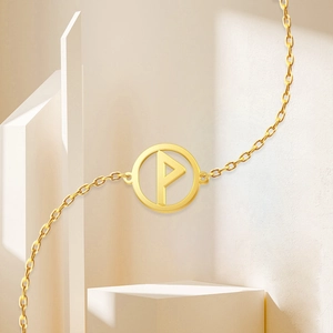 Detail of 18K gold stainless steel necklace featuring a round hollow P letter pendant