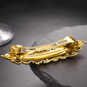 French vintage style golden metal flower hair clip with hollow carved floral design
