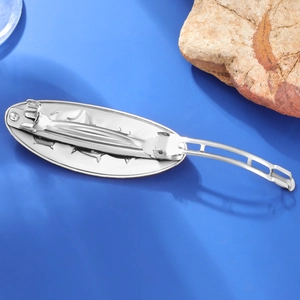 Silver alloy cat hair clip showing the durable metal spring fastener mechanism