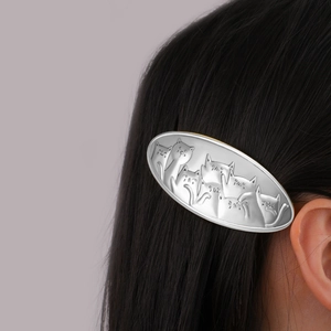 Vintage silver alloy hair clip featuring detailed embossed cute cat figures for women