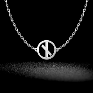 Detailed view of silver Viking Rune necklace with hollow circular pendant and X symbol