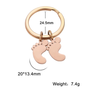 Detailed view of rose gold footprint pendants with precise dimensions and weight specs