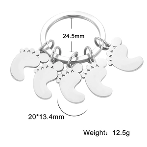 Polished stainless steel footprint keychain detail with dimensions and weight specs