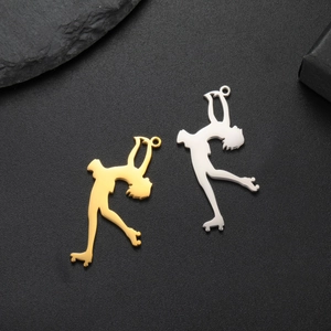 Detailed view of gold and silver figure skating pendant charms for DIY jewelry making
