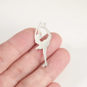 Polished silver figure skating pendant showing a graceful arabesque pose detail