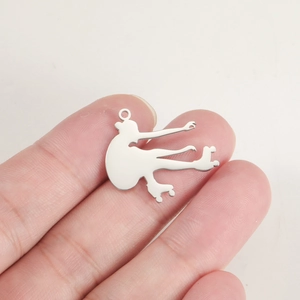 Detail showing the size of a polished stainless steel roller skater silhouette pendant