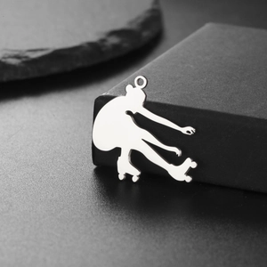 Polished stainless steel roller skater silhouette pendant with reflective mirror finish