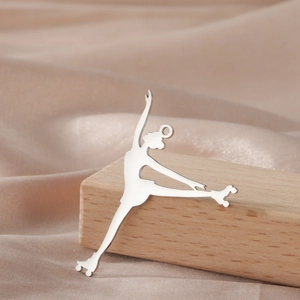 Detailed view of an elegant 18K gold plated stainless steel roller skater girl pendant