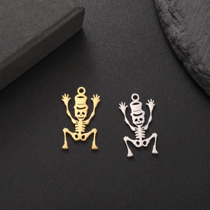 Detail of 18K gold and silver stainless steel skeleton skull pendants for DIY jewelry