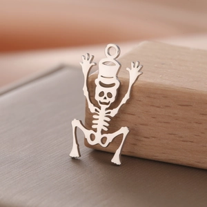 Detailed view of a polished 18K gold-plated stainless steel skeleton pendant with top ring
