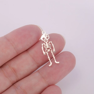 Detailed close-up of a 18K gold-plated hollow skeleton pendant for jewelry making