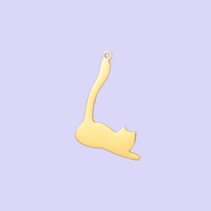Detailed view of a polished gold cat-shaped pendant with a vertical tail hanging loop