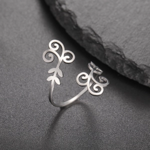 Polished stainless steel open ring featuring vintage vine filigree and scroll patterns