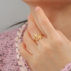 Adjustable snowflake stainless steel ring in gold finish worn by model for Christmas