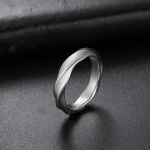Macro view of matte Mobius twist ring in stainless steel with a satin silver finish