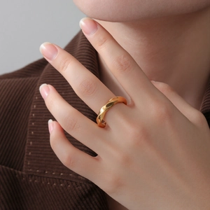 Minimalist spiral gold stainless steel ring with a geometric twisted design for women