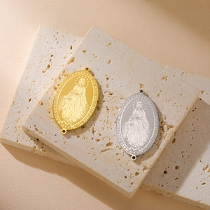 Gold and silver Virgin Mary medals in stainless steel with religious relief engraving