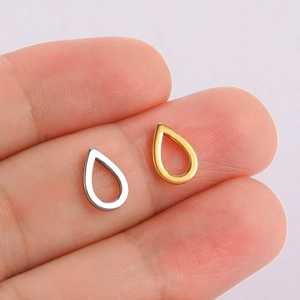 Polished hollow teardrop pendants in 18K gold and silver plating shown for size