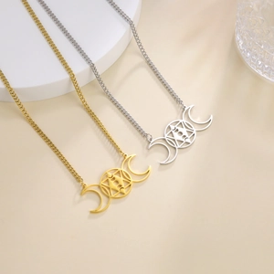 Detail shot of 18k gold plated stainless steel triple goddess moon and star pendants