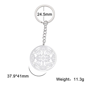Polished silver stainless steel keychain with symmetrical hollow floral pattern pendant