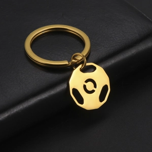 Golden barbell weight plate keychain in polished stainless steel for fitness lovers