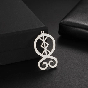 Vintage stainless steel Nordic rune pendant charm on black matte jewelry box