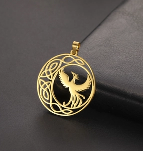 Detailed close-up of gold stainless steel phoenix pendant with Celtic knot accents