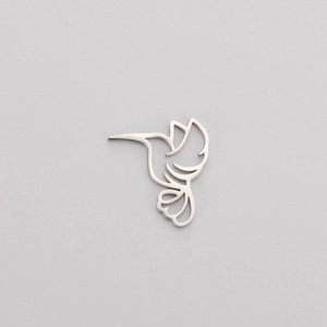 Detailed view of polished hollow hummingbird charm made of durable stainless steel