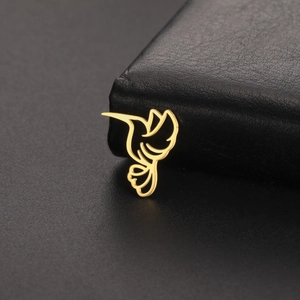 Minimalist golden hollow hummingbird pendant made of stainless steel on black leather
