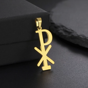 Polished gold stainless steel Chi-Rho religious pendant on a black jewelry display