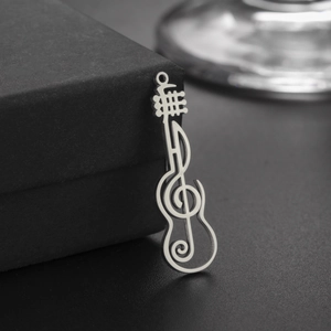 Polished stainless steel guitar pendant with musical treble clef cutout design