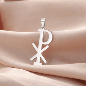 Polished silver Chi Rho pendant on pink satin background for DIY jewelry making