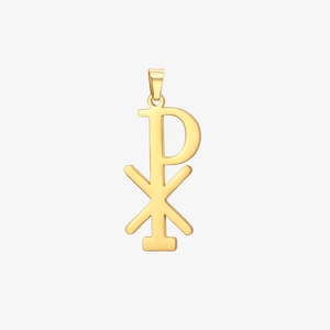 Macro detail of gold plated Chi Rho religious symbol pendant with polished mirror finish