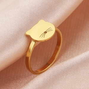 Polished 18K gold stainless steel ring featuring a minimalist hollow cat head design