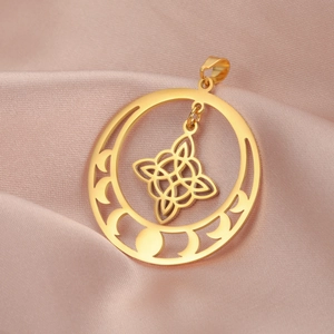 Golden vintage witches knot pendant with crescent moon phases on pink satin background