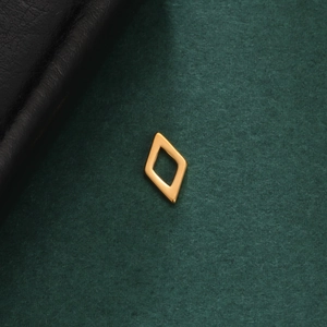Macro shot of minimalist hollow rhombus pendant in 18K gold plated stainless steel