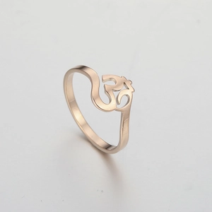 Polished 18K rose gold titanium steel ring featuring a cut-out Om yoga spiritual symbol