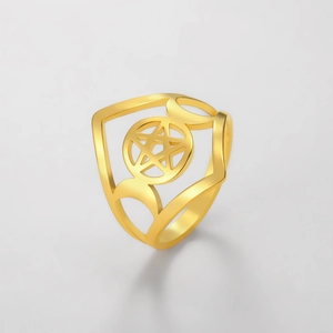 Macro shot of gold-plated triple goddess moon and pentagram ring with polished finish